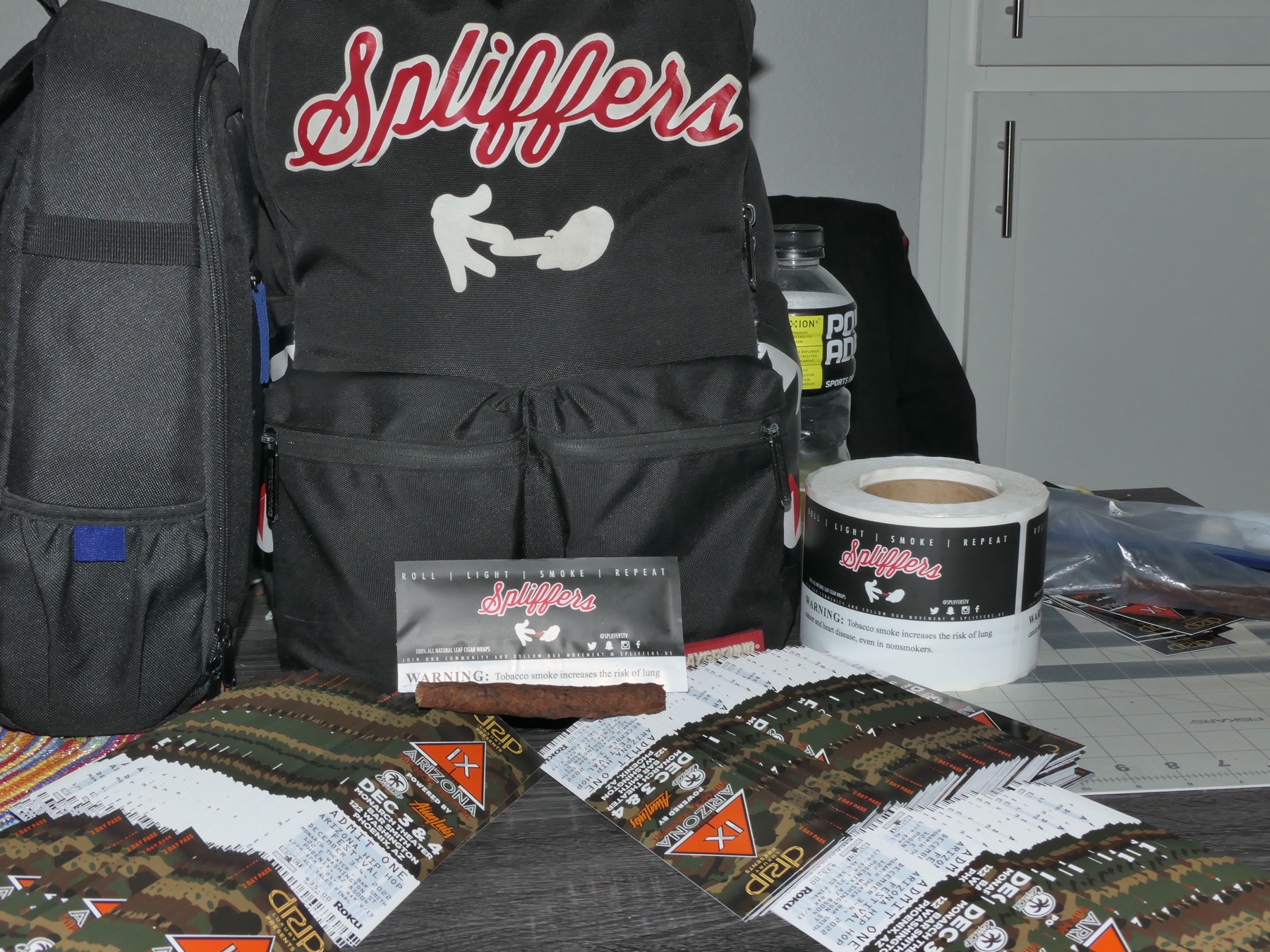 Spliffers table display with product, bag, and merch